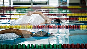 Two female swimmers during a race in the freestyle swim discipline