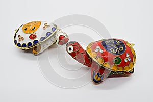Two feng-shui colored metal turtles with detachable carapace shell for jewelry depositing