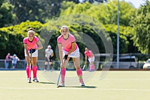 Two field hockey players waiting for penalty shot