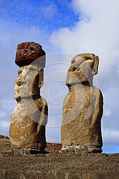 Two of Fifteen Moai Statues and the Only One with Topknot Called Pukao Made from Red Scoria, Ahu Tongariki Easter Island, Chile