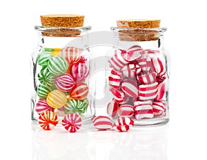 Two filled glass candy jars