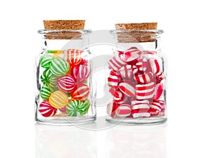 Two filled glass candy jars photo