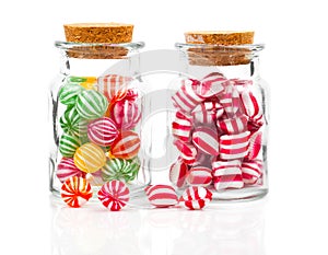 Two filled glass candy jars