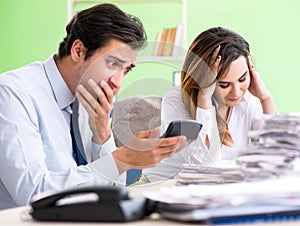 Two financial specialists working in the office