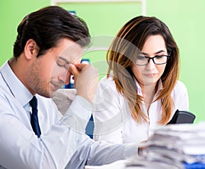 Two financial specialists working in the office