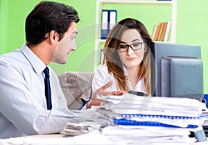 Two financial specialists working in the office