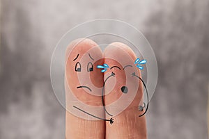 Two fingers are like two people. One of them cries, the other calms. Cartoon men. The concept of mutual help, psychological