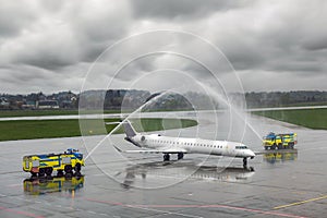 Two fire trucks pouring water photo