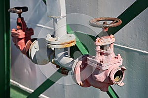 Two fire valves for connecting fire hoses to extinguish a fire on a ship