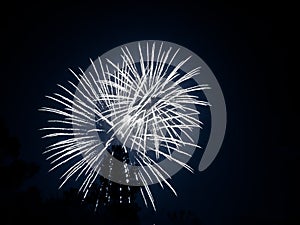 Two fireballs of fireworks at black night sky