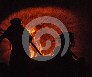 Two Firefighters attacking a fire