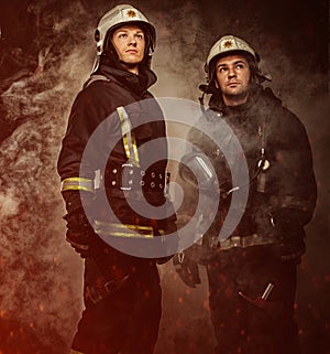 Two firefighters in a smoke