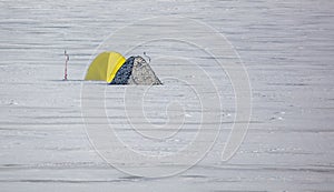 Two fisherman's tents on the ice in winter. Sport