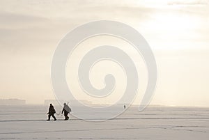Two fishermen on winter fishing