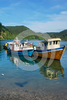 Two fishing boats anchored in Puerto Montt, Chile