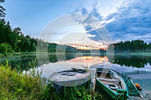 Two fishing boats on a lake at dawn