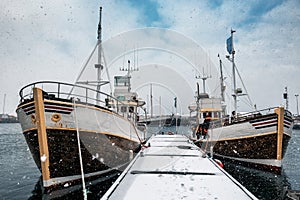 Two fishing boats near the pier