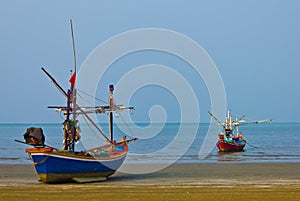 Two fishing boats at the sea