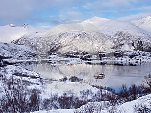 Two fishing boats on the sea near Svolvaer on Lofoten islands, Norway in winter