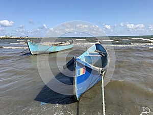 Two fishing boats at the seashore