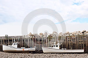 Two fishing boats sitting on the bottom