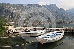 Two fishing boats and a small dock in Montenegro