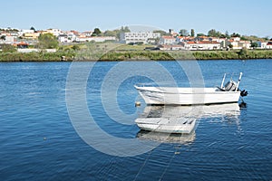 Two fishing boats tired together