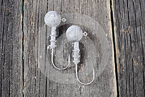 two fishing hooks with a sinker