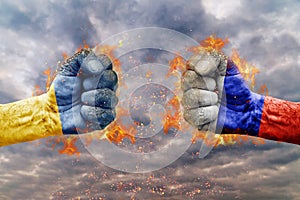 Two fist with the flag of Russia and Ukraine faced at each other