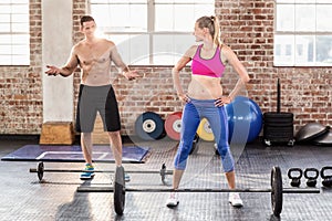 Two fit people working out