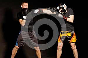 Two fit young boxers fighting in the ring