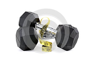 Two fitness dumbbells with tape measure white background