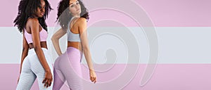 Two fitness women in sportswear isolated over gray background. Sport and fashion concept wit chopy space.