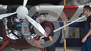 Two flight mechanics doing a pre flight check