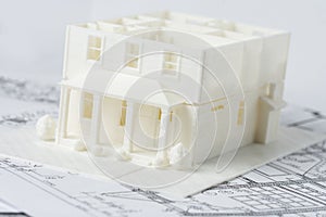 Two floors model of the family house printed on a 3D printer with white filament by FDM technology for architectural use