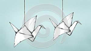 Two flying Paper Cranes