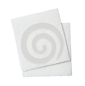 Two folded pieces of white tissue paper or napkin in stack tidily prepared for use in toilet or restroom isolated on white photo