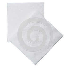 Two folded pieces of white tissue paper or napkin in stack tidily prepared for use in toilet or restroom isolated on white photo