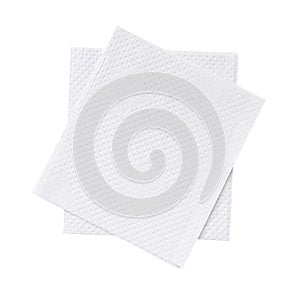 Two folded pieces of white tissue paper or napkin in stack tidily prepared for use in toilet or restroom isolated on white photo