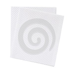 Two folded pieces of white tissue paper or napkin in stack tidily prepared for use in toilet or restroom isolated on white photo