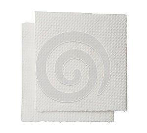 Two folded pieces of white tissue paper or napkin in stack tidily prepared for use in toilet or restroom isolated on white