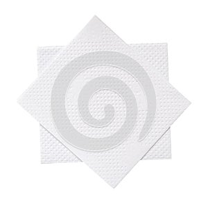 Two folded pieces of white tissue paper or napkin in stack tidily prepared for use in toilet or restroom isolated on white