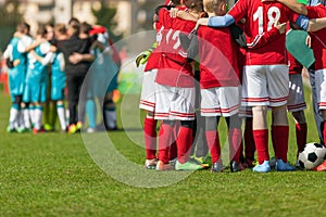 Two Football Teams Standing in Team Circles Before Tournament Final Match. School Soccer Players in Red and Blue Soccer Jerseys