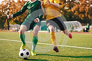 Two Footballers Running and Kicking Game. Adult Football Players Compete in Soccer Match