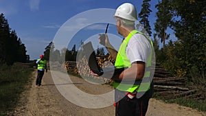 Two forest inspectors on the woods road