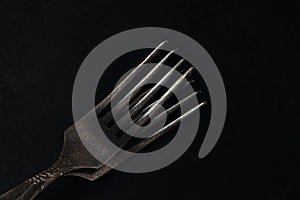 Two forks on a black background