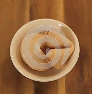 Two Fortune Cookies in Small Bowl