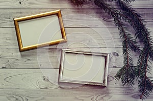 Two frames for photos on a light, vintage wooden background