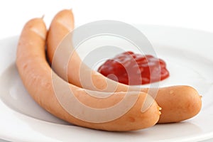 Two frankfurter sausages on a plate