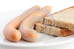 Two frankfurter sausages on a plate